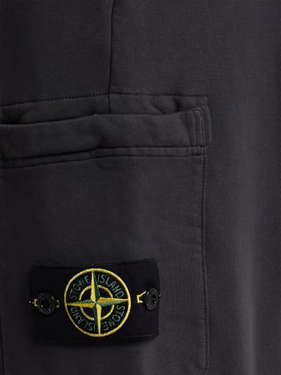 Stone Island: 有口袋的锥形裤子