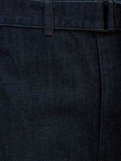 Lemaire: Twisted denim trousers with leather belt