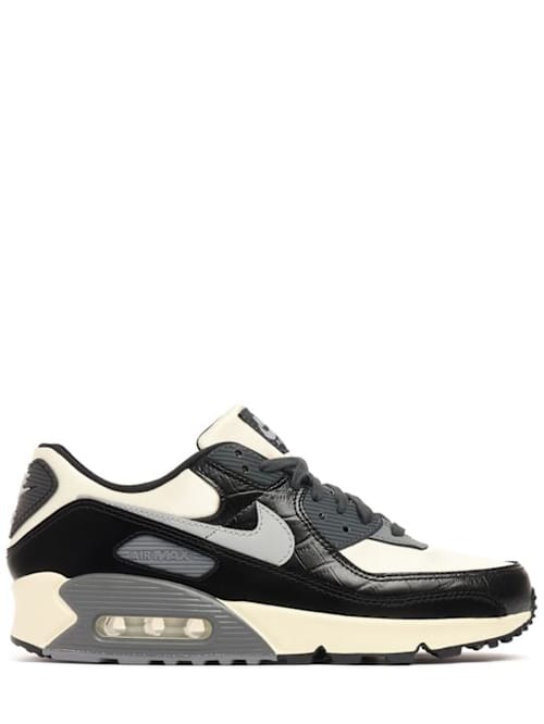 Nike: Low-top sneakers with overlapping details