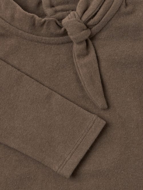 1 + IN THE FAMILY: Top with tie collar