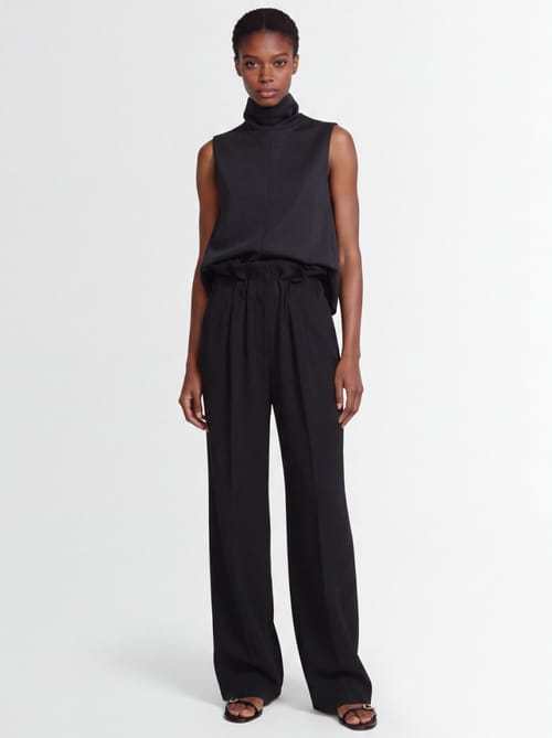 Khaite: Kira virgin wool draped-waist trousers