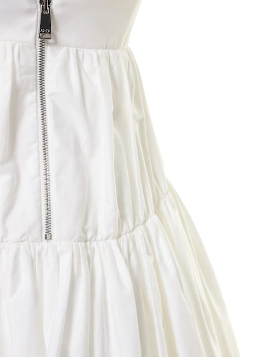 Area: Robe en coton avec manches bouffantes