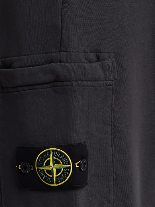 Stone Island: 有口袋的锥形裤子