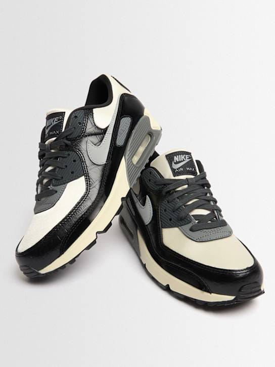 Nike: Low-top sneakers with overlapping details