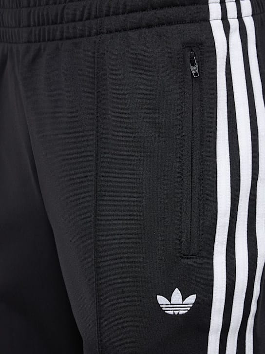 adidas Originals: 侧条纹宽腿裤