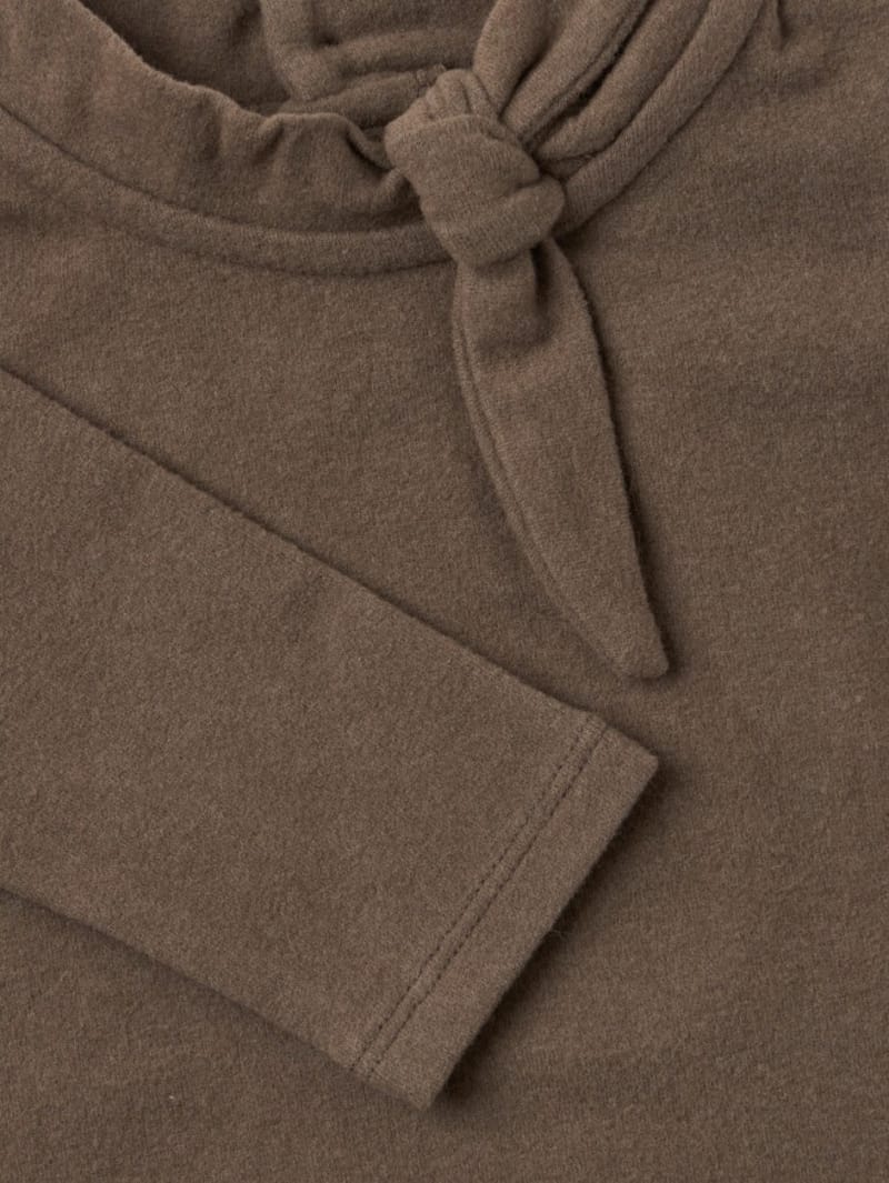 1 + IN THE FAMILY: Top with tie collar