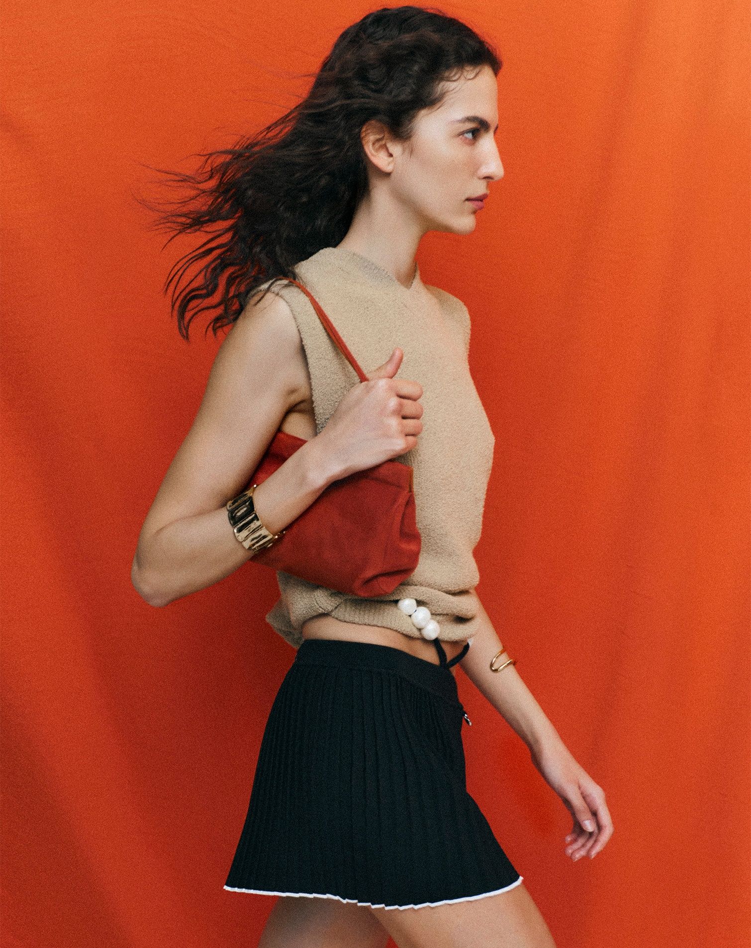 Model with trendy summer look with vintage  rigid and sculptural bracelet