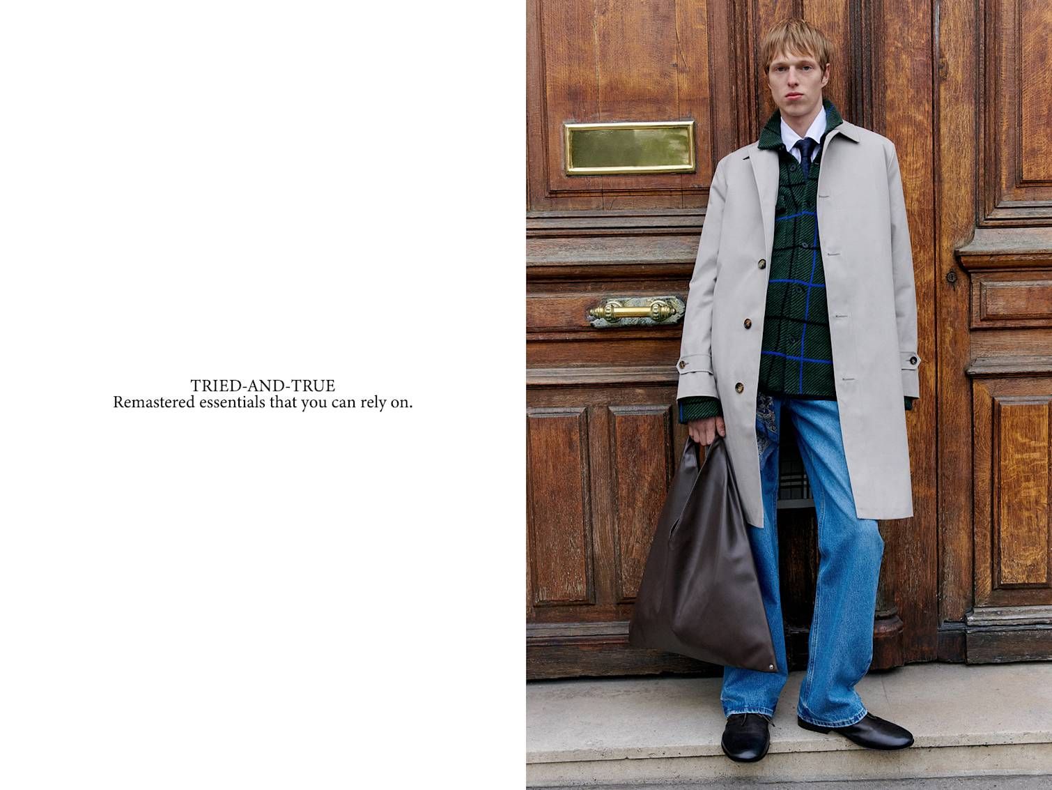 Man poses in front of wooden door in Paris with Burberry trench coat MM6 Maison Margiela Classic Japanese synthetic bag.