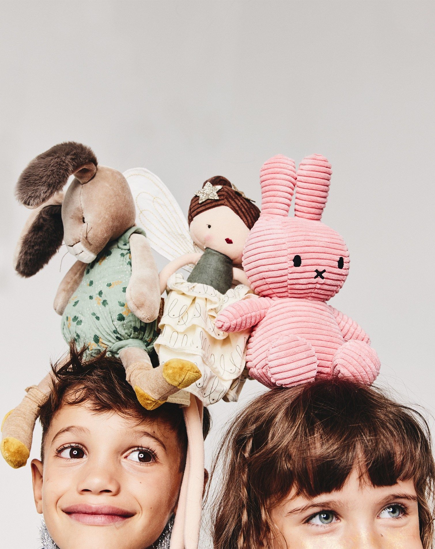 Boy and girl with plush toys
