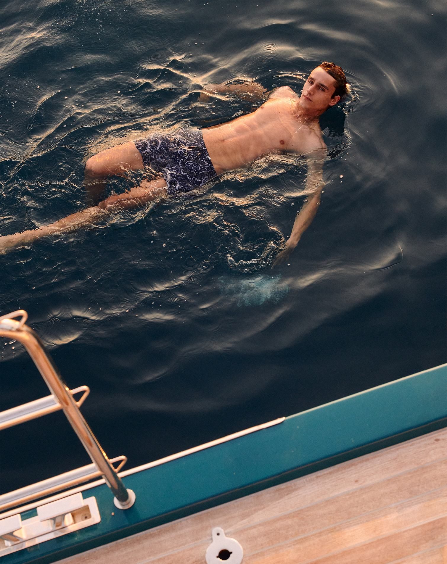 men with designer bathing suit having a bath