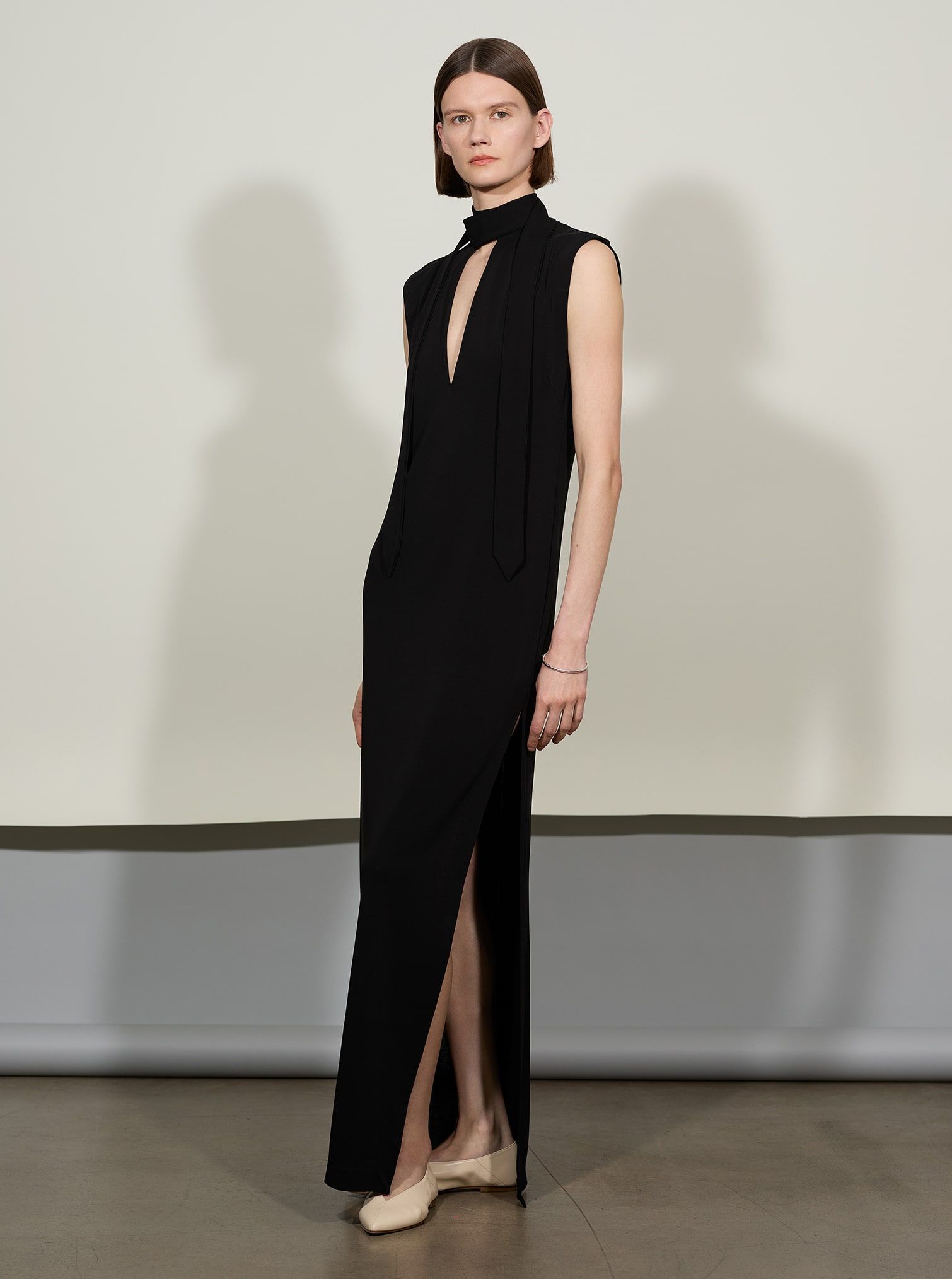 Model wears BITE Studios black La nuit dress made with responsible viscose.